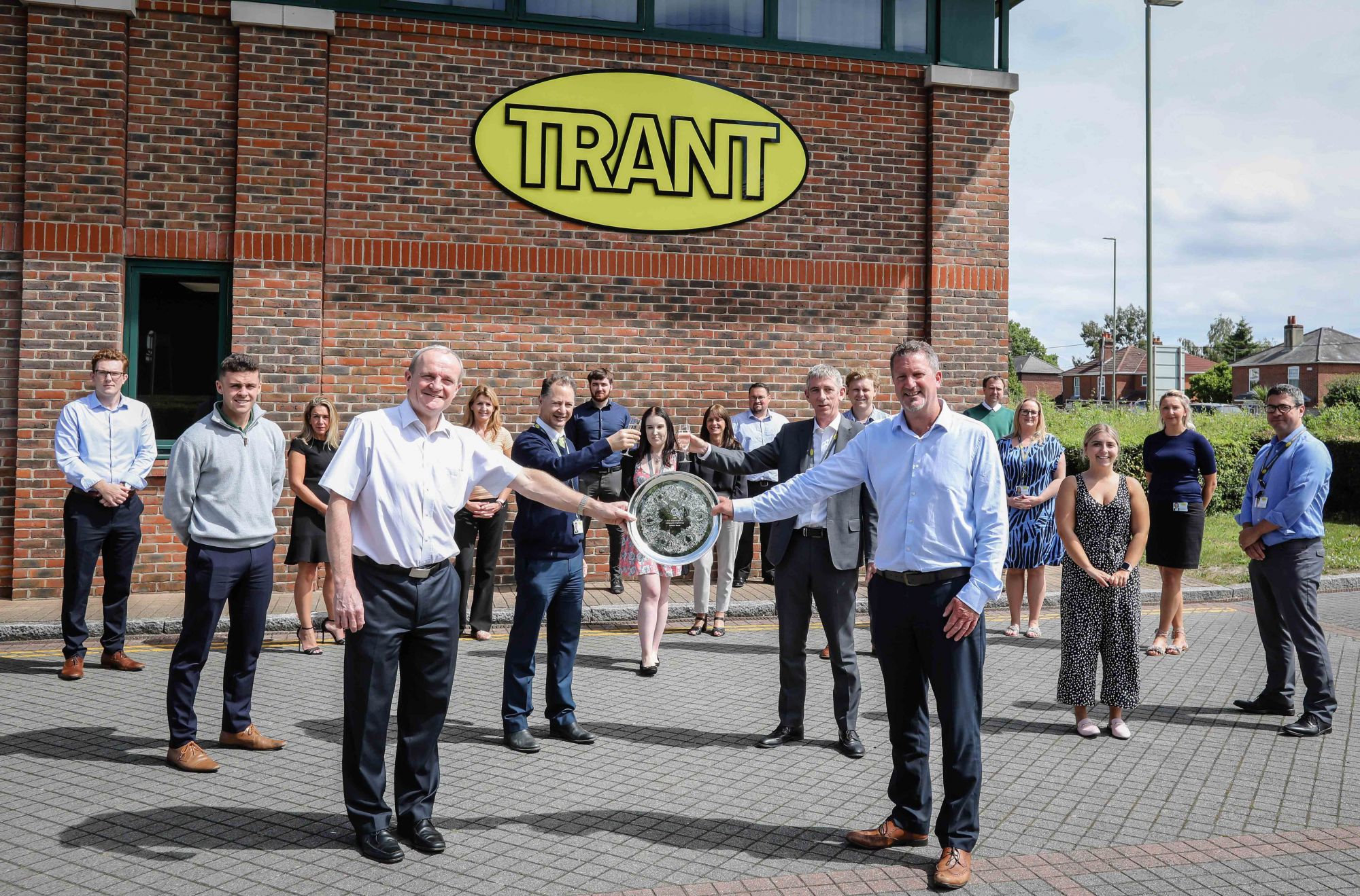 ACCOLADE: Trant Engineering’s health and safety team outside the multi-disciplinary contractor’s head office near Southampton. Pictured in front with colleagues, and with the trophy from the Royal Society for the Prevention of Accidents (RoSPA), are Gerry Somers, left, Trant Engineering’s Managing Director UK, and David Foster, head of Safety, Health, Environment and Quality at the firm. Trant Engineering has been awarded its 32nd consecutive award by RoSPA.